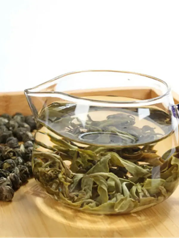 A photo of jasmine green tea in a pot